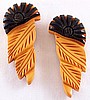 BP85 pr butterscotch/black bakelite carved dress clips